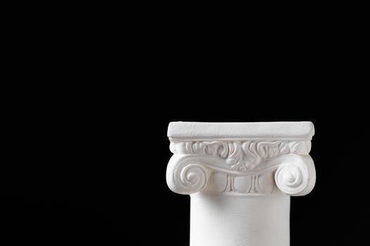 White Ionic Design Column on Dark Background.