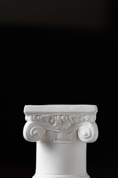 White Ionic Design Column on Dark Background.