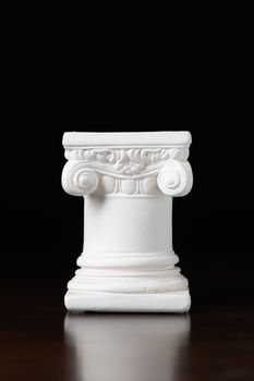 White Ionic Design Column on Dark Background.