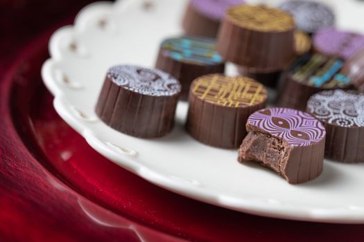 Artisan Fine Chocolate Candy On Serving Dish with Heart Design.