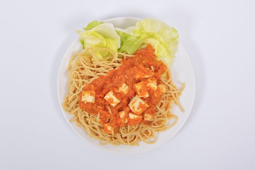 Bolognese spaghetti with tofu on a white background