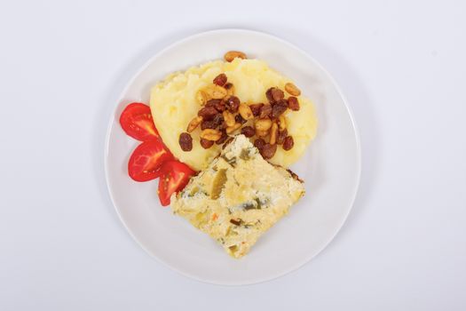 Baked leek with mashed potatoes on a white background