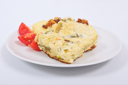 Baked leek with mashed potatoes on a white background