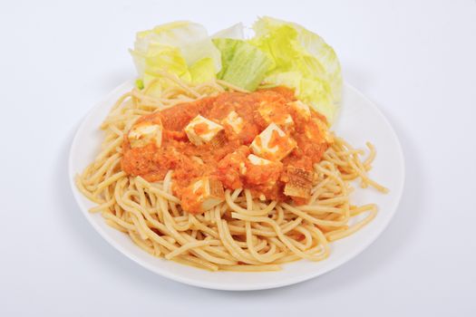 Bolognese spaghetti with tofu on a white background