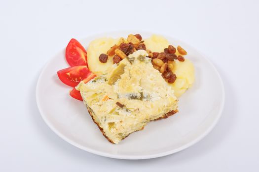 Baked leek with mashed potatoes on a white background