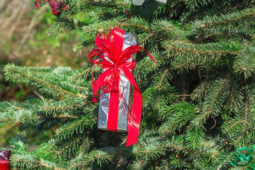 Beautiful christmas tree with gift boxes and shopping bags 