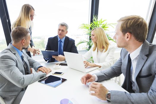 Business people team at meeting working with papers