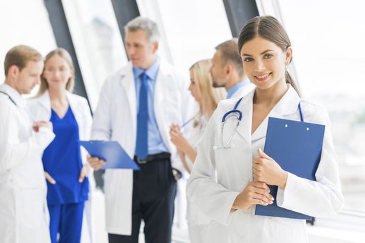 Young female doctor and medical team in hospital