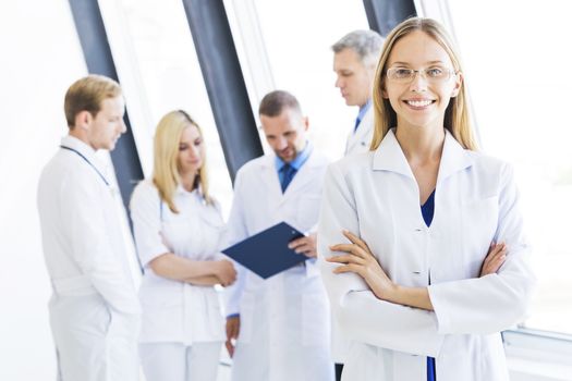 Young female doctor and medical team in hospital