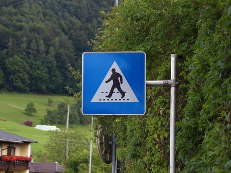 Warning Pedestrian Sign of Man with Hat at Crossover