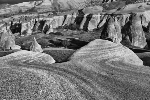 Eroded stone cliffs look like mushrooms near Goreme, Cappadocia, Turkey