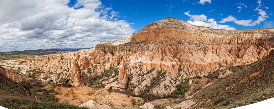 Beautiful stone cliffs in valley named Rose valley near Meskendir, Goreme, Turkey