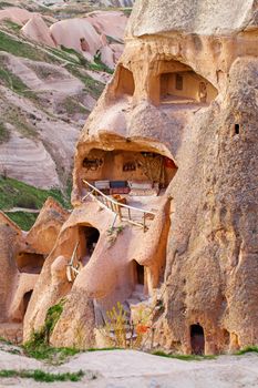 Stone cliffs and cave houses in Uchisar near Goreme, Turkey