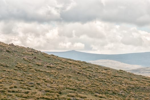 Thabana Ntlenyana, the small peak in the distance, is at 3482 m the highest point in Southern Africa. Seen from the top of Black Mountain Pass in Lesotho