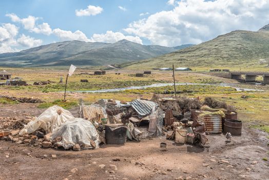 The Mamokae village at the foot of the Black Mountain Pass in Lesotho. Cow dung and dried bushes are stored to use as fuel for fires as the villages is above the tree line