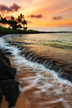 A beautiful sunrise at the beach on the south shore of Kauai, Hawaii.