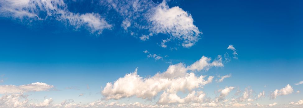 panorama of beautiful cloudscape on a blue sky. wonderful summer weather background