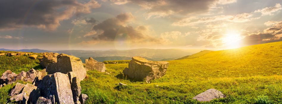 beautiful panorama of Runa mountain at sunset. huge rocky formation on the hillside and peak in the distance. wonderful landscape of Carpathians