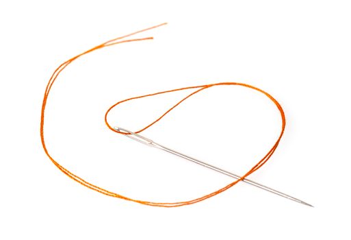 orange thread in a needle on a white isolated background