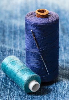 blue threads on the background of a denim jacket