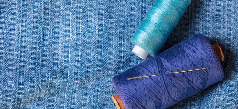 blue threads on the background of a denim jacket