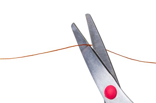 scissors cut the thread on a white isolated background