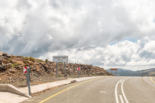 The highest point of  Black Mountain Pass in Lesotho. The top is 3240 meter above sea level. The directional sign to the Thabana Ntlenyana viewpoint is visible