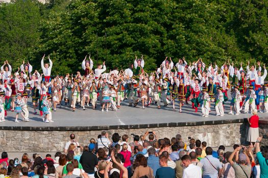 KIEV, UKRAINE - July 22 , 2016: Ukraina School of Dance Ensemble girls and boys dressed in traditional red Ukrainian embroidered costume clothes dancing