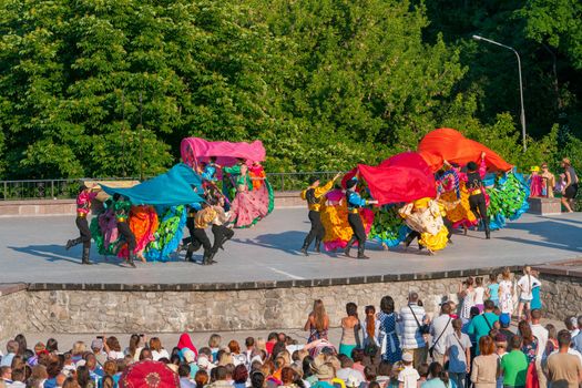 KIEV, UKRAINE - July 22 , 2016: Ukraina School of Dance Ensemble girls and boys dressed in traditional red Ukrainian embroidered costume clothes dancing