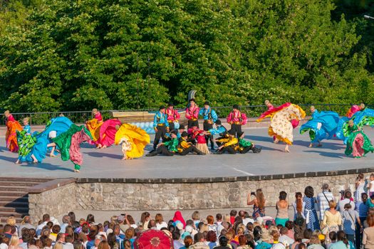 KIEV, UKRAINE - July 22 , 2016: Ukraina School of Dance Ensemble girls and boys dressed in traditional red Ukrainian embroidered costume clothes dancing