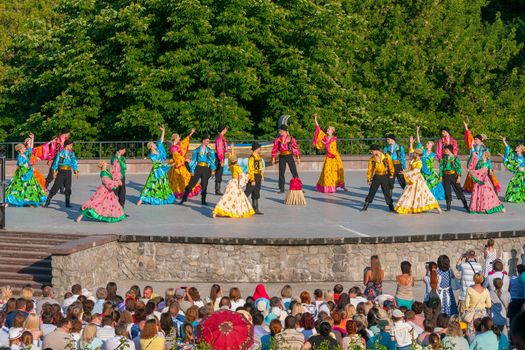 KIEV, UKRAINE - July 22 , 2016: Ukraina School of Dance Ensemble girls and boys dressed in traditional red Ukrainian embroidered costume clothes dancing