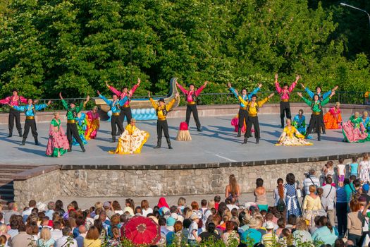 KIEV, UKRAINE - July 22 , 2016: Ukraina School of Dance Ensemble girls and boys dressed in traditional red Ukrainian embroidered costume clothes dancing