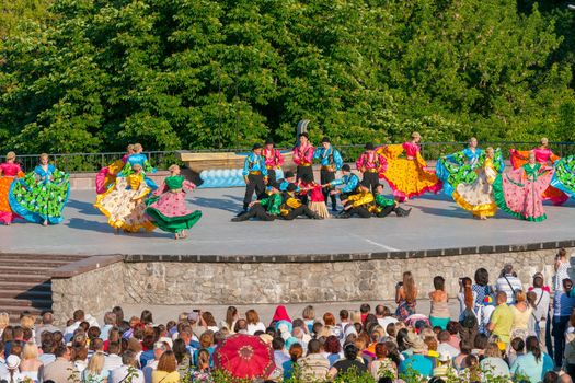 KIEV, UKRAINE - July 22 , 2016: Ukraina School of Dance Ensemble girls and boys dressed in traditional red Ukrainian embroidered costume clothes dancing