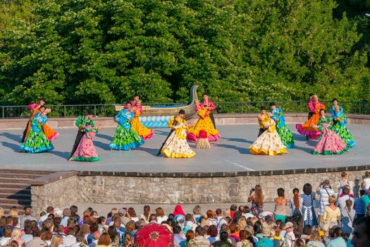 KIEV, UKRAINE - July 22 , 2016: Ukraina School of Dance Ensemble girls and boys dressed in traditional red Ukrainian embroidered costume clothes dancing