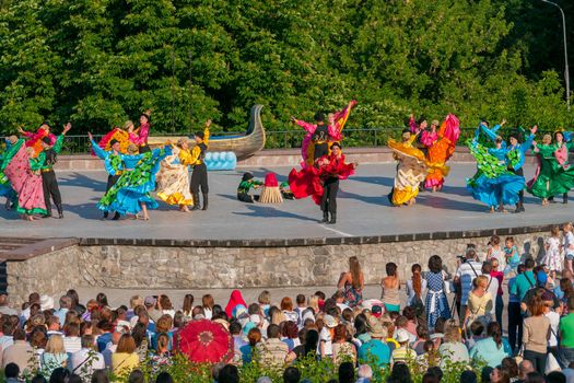 KIEV, UKRAINE - July 22 , 2016: Ukraina School of Dance Ensemble girls and boys dressed in traditional red Ukrainian embroidered costume clothes dancing