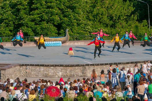 KIEV, UKRAINE - July 22 , 2016: Ukraina School of Dance Ensemble girls and boys dressed in traditional red Ukrainian embroidered costume clothes dancing