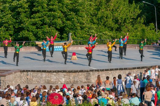 KIEV, UKRAINE - July 22 , 2016: Ukraina School of Dance Ensemble girls and boys dressed in traditional red Ukrainian embroidered costume clothes dancing