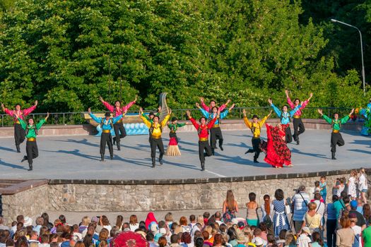 KIEV, UKRAINE - July 22 , 2016: Ukraina School of Dance Ensemble girls and boys dressed in traditional red Ukrainian embroidered costume clothes dancing