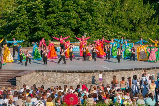 KIEV, UKRAINE - July 22 , 2016: Ukraina School of Dance Ensemble girls and boys dressed in traditional red Ukrainian embroidered costume clothes dancing