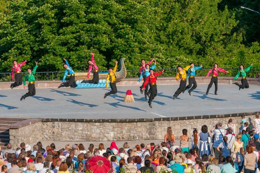 KIEV, UKRAINE - July 22 , 2016: Ukraina School of Dance Ensemble girls and boys dressed in traditional red Ukrainian embroidered costume clothes dancing