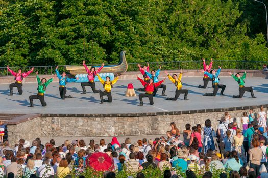 KIEV, UKRAINE - July 22 , 2016: Ukraina School of Dance Ensemble girls and boys dressed in traditional red Ukrainian embroidered costume clothes dancing