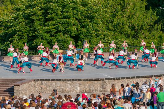 KIEV, UKRAINE - July 22 , 2016: Ukraina School of Dance Ensemble girls and boys dressed in traditional red Ukrainian embroidered costume clothes dancing