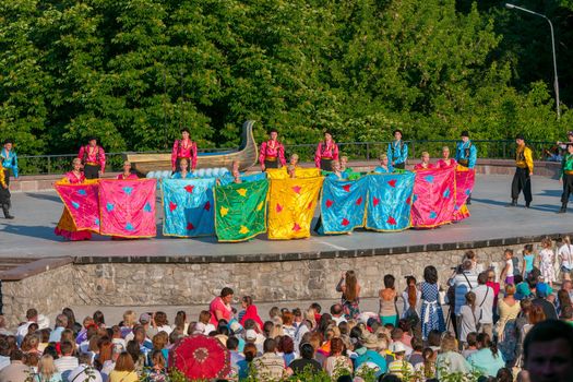 KIEV, UKRAINE - July 22 , 2016: Ukraina School of Dance Ensemble girls and boys dressed in traditional red Ukrainian embroidered costume clothes dancing