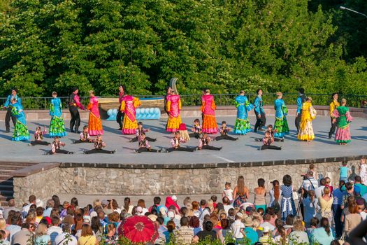 KIEV, UKRAINE - July 22 , 2016: Ukraina School of Dance Ensemble girls and boys dressed in traditional red Ukrainian embroidered costume clothes dancing