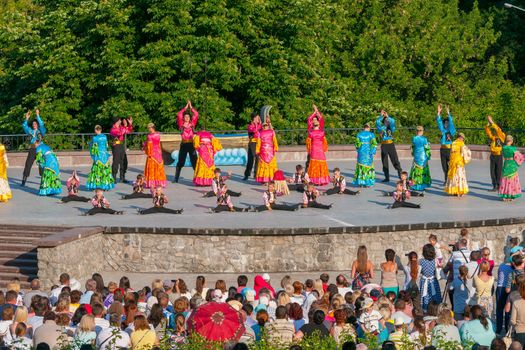 KIEV, UKRAINE - July 22 , 2016: Ukraina School of Dance Ensemble girls and boys dressed in traditional red Ukrainian embroidered costume clothes dancing