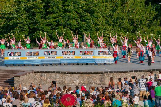 KIEV, UKRAINE - July 22 , 2016: Ukraina School of Dance Ensemble girls and boys dressed in traditional red Ukrainian embroidered costume clothes dancing