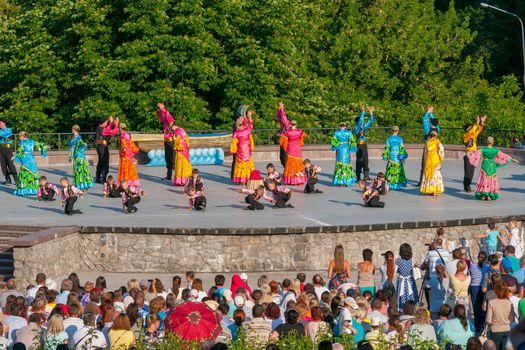 KIEV, UKRAINE - July 22 , 2016: Ukraina School of Dance Ensemble girls and boys dressed in traditional red Ukrainian embroidered costume clothes dancing