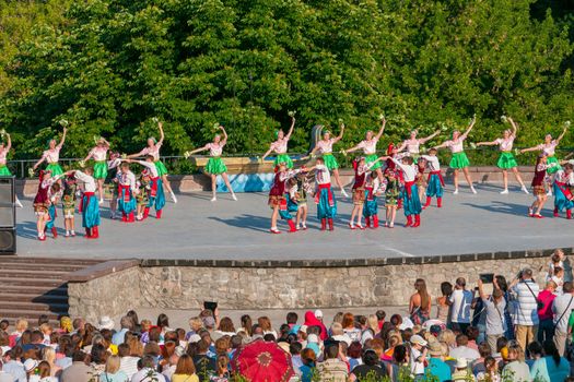 KIEV, UKRAINE - July 22 , 2016: Ukraina School of Dance Ensemble girls and boys dressed in traditional red Ukrainian embroidered costume clothes dancing