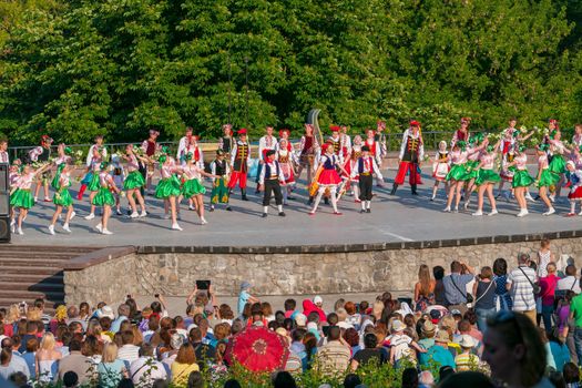 KIEV, UKRAINE - July 22 , 2016: Ukraina School of Dance Ensemble girls and boys dressed in traditional red Ukrainian embroidered costume clothes dancing