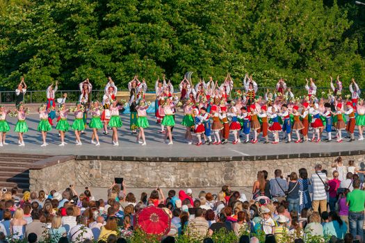 KIEV, UKRAINE - July 22 , 2016: Ukraina School of Dance Ensemble girls and boys dressed in traditional red Ukrainian embroidered costume clothes dancing